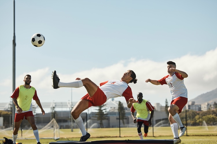 Sports, Soccer And Soccer Player With Team And Soccer Ball In Power Kick While Playing On Soccer Fi soccer-sports-hypnosis